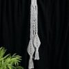 Handmade macramé decoration made from grey coloured cotton yarn